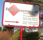 Firmenschild 'Fliesenlegermeister Jochen Singer'